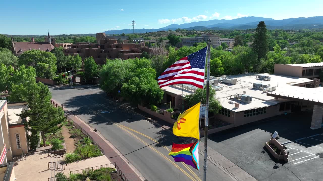 American, New Mexico, and pride flags waving in downtown Santa Fe, NM