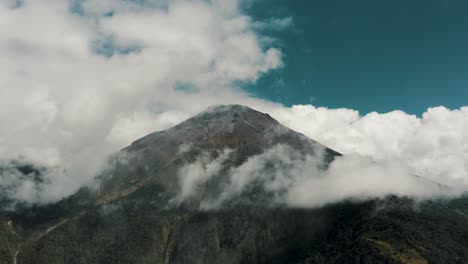 white clouds and blue sky at tungurahua stratovolcano in ecuador - drone shot