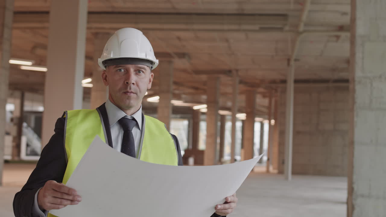 Caucasian Construction Supervisor Posing with Paper