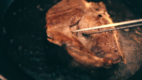 frying meat on boiling oil in the pan