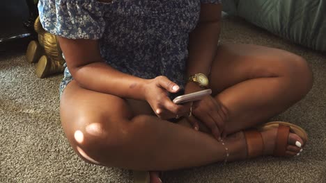 high angle view of female millennial scrolling on phone