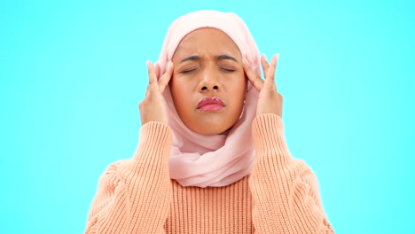 Muslim-woman,-headache-and-pain-in-studio