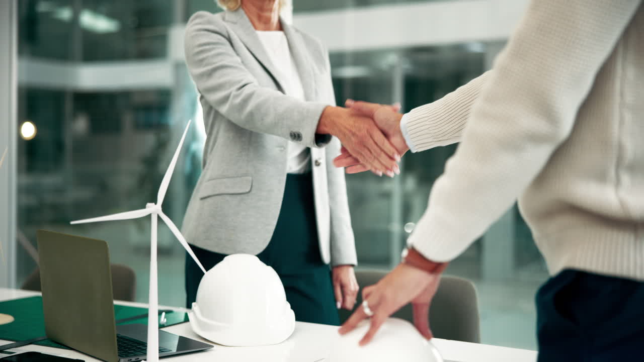 Business handshake in an office setting
