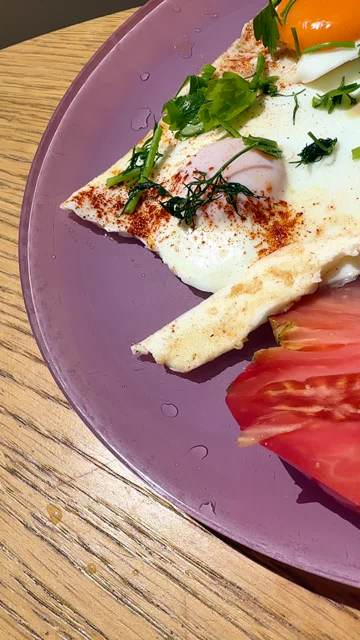 Food plate with tomato, fried egg and meat