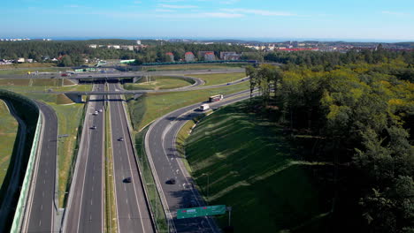 top down aerial - wide multi-lane road - modern road infrastructure - expressway close to urban agglomeration