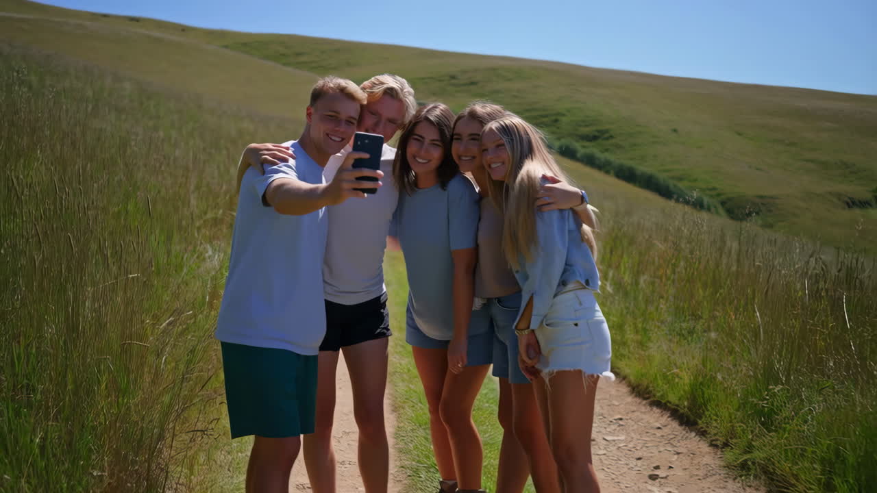 Friends taking a selfie on a hiking trail