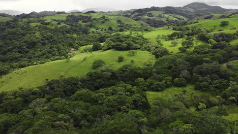 aerial view of green land field vegetation on the tropical hills of costa rica central america travel holiday destination