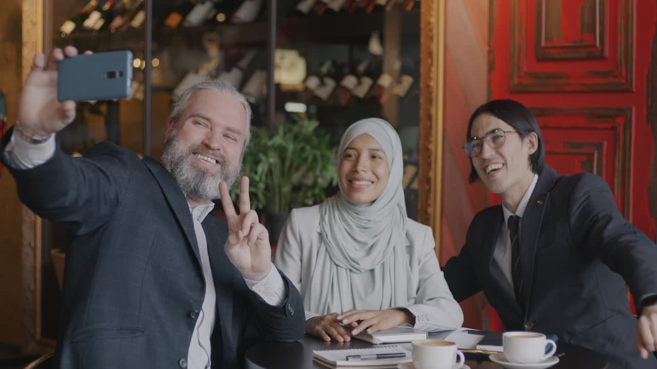 Business People Taking a Selfie in a Cafe