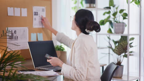 woman using calculator analyzing company finances