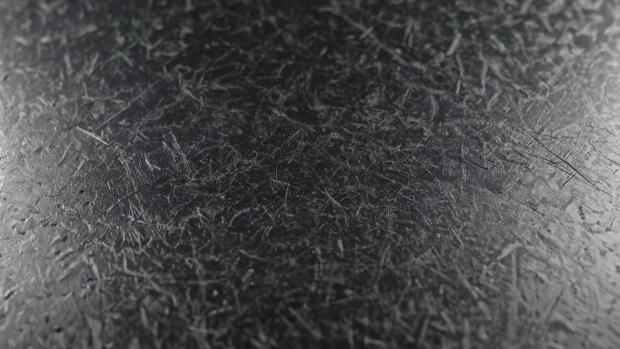 Close Up of Dark Scratched Metal Surface Texture