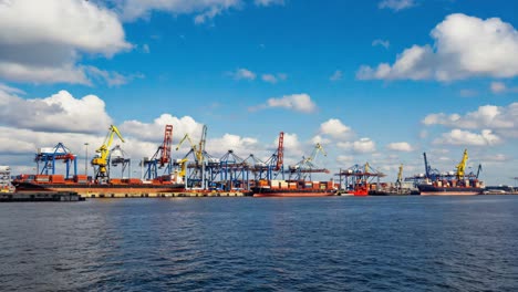 busy container port with cargo ships and gantry cranes