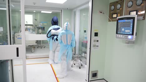 medic staffs putting on papr suits before entering covd-19 ward