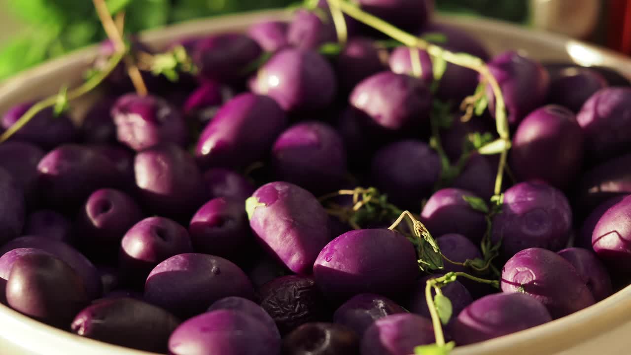 Vibrant Purple Potatoes and Fresh Thyme in a Ceramic Bowl