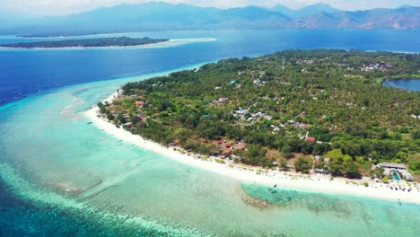 paradise tropical island with hotels and villas hidden by lush vegetation and trees, surrounded by long white beach and turquoise lagoon with corals and pebbles