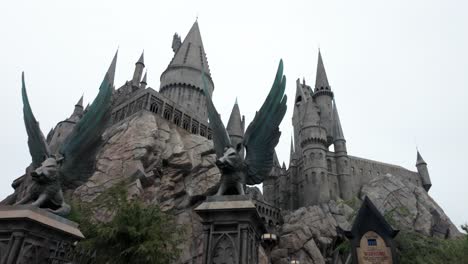 tilting up shot of harry potter's hogwarts castle at universal studios in los angeles, california.