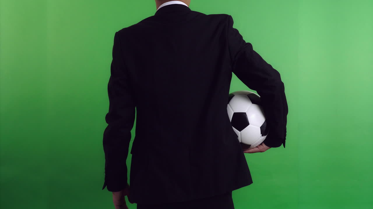 Back Of Football Manager Holding Soccer Ball, Video In 4K