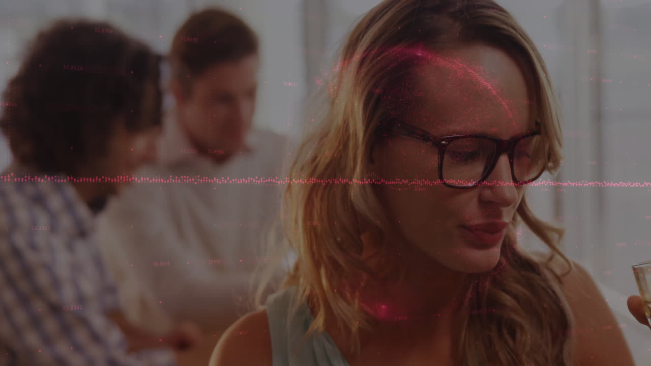 Woman wearing glasses reviewing documents at business office desk, featuring audio waveform overlay