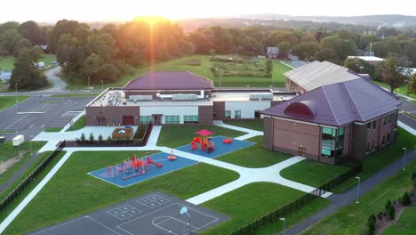 aerial of school building in usa at sunset, sunrise