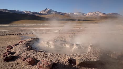 El-Tatio-geysers-boiling-at-sunrise-in-the-Atacama-desert-in-Chile,-South-America