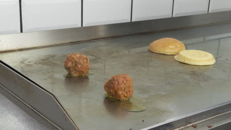 cooking meatballs on a griddle