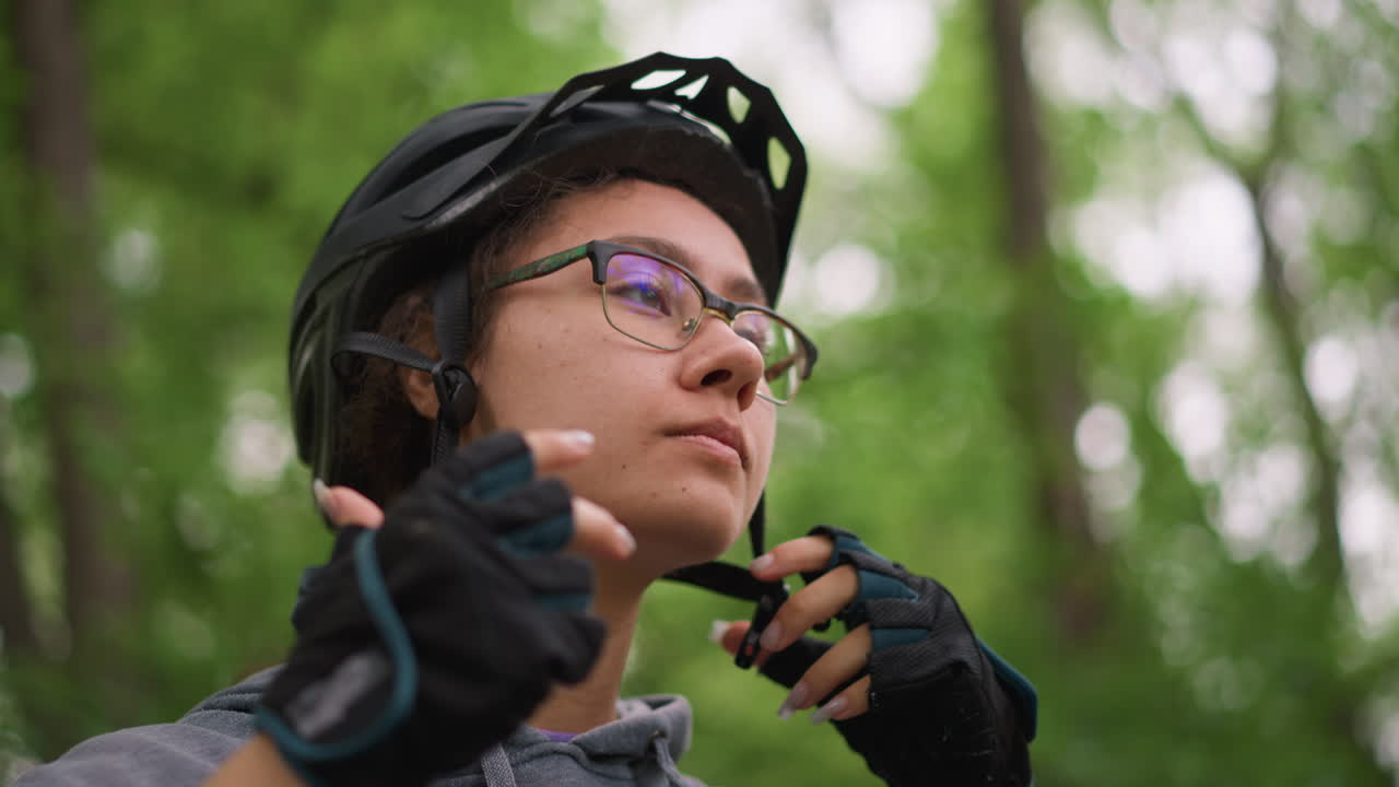 Mountain Cyclist Arranges Equipment Carefully, Motivated Rider Meticulously Organizes Necessary Riding Gear, Diligent Cyclist Carefully Prepares Specialized Gear For Upcoming Mountain Expedition