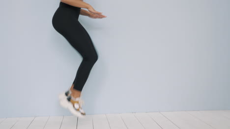 woman doing jumping jacks