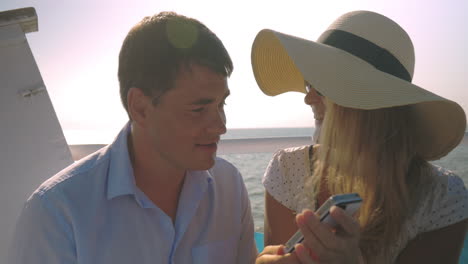 Couple-taking-selfie-on-board-the-ship