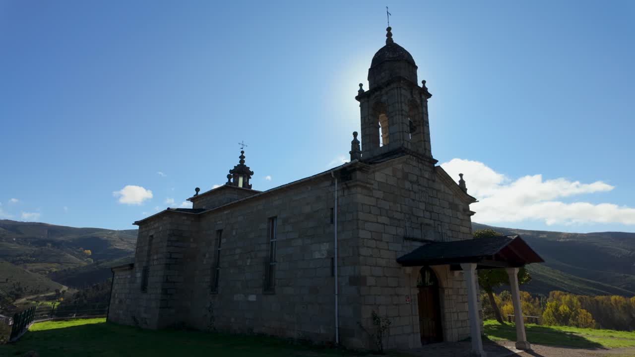 Exterior view of Alberguería church in Veiga de Cascallá, Rubiá, Galicia, Spain, with stone walls