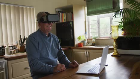 senior man wearing vr headset at home