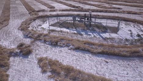 Rotating-aerial-of-natural-gas-pipeline-monitoring-station-in-wheat