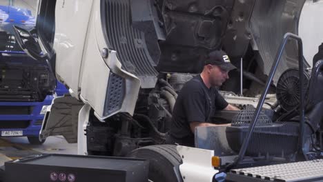 auto mechanic repairs a truck