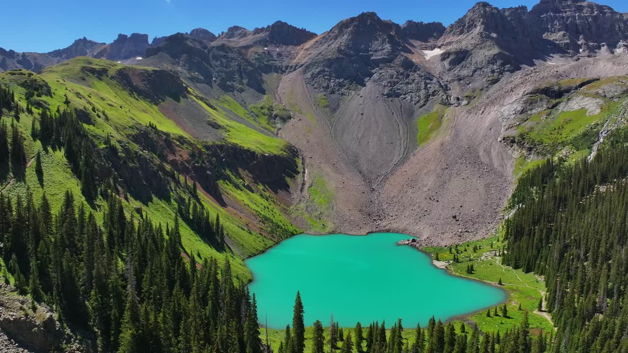 Mount Sneffels Wilderness Lower Blue Lake beautiful sunny morning Ridgway Telluride Colorado aerial drone San Juan Rocky Mountains Uncompahgre National Forest Dallas Range blue sky circle right pan up