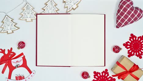 christmas decoration with blinking lights and opened book for text on white theme. stop motion