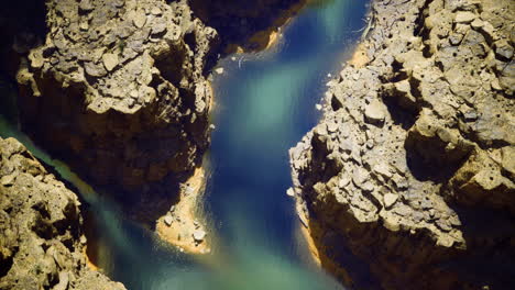 stunning aerial view of a winding river through rugged landscapes