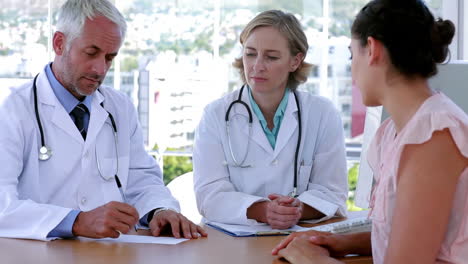 doctors speaking with patient