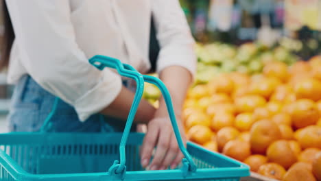 woman shopping for fruits at the grocery store