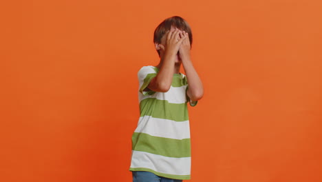 happy excited child boy laughing out loud after hearing ridiculous anecdote reaction on funny joke