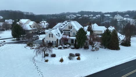 american mansion in winter snow at rural area