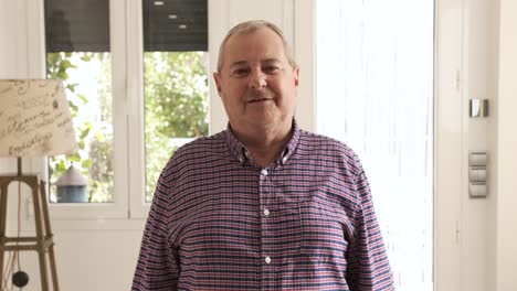 mature man looking at the camera while talking