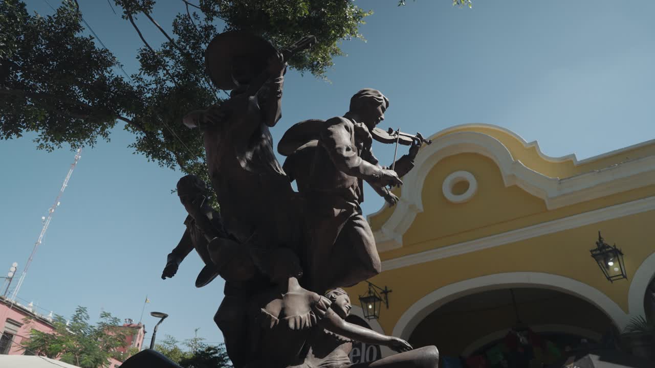 Statue of Mariachi Musicians in a City Square