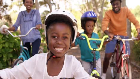 portrait of cute girl is smiling to the camera in front of her family