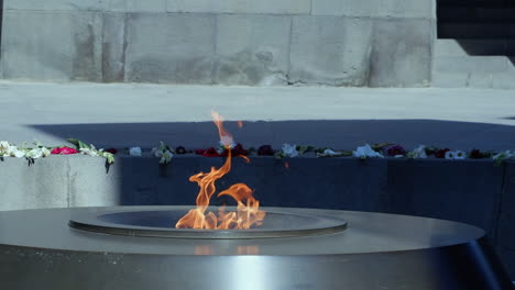 close up eternal flame burns at tsitsernakaberd memorial in armenia