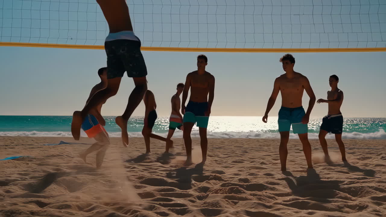 Young Men Playing Beach Volleyball on a Sunny Beach