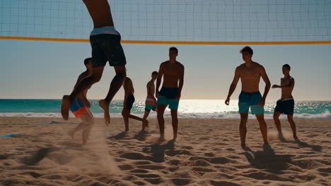 young men playing beach volleyball on a sunny beach