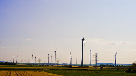 sunny countryside wind turbines. wind turbines stand tall in a vast field under a bright sky, showcasing renewable energy in a rural landscape