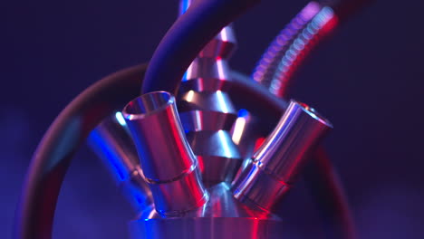 close-up of a hookah pipe with neon lighting