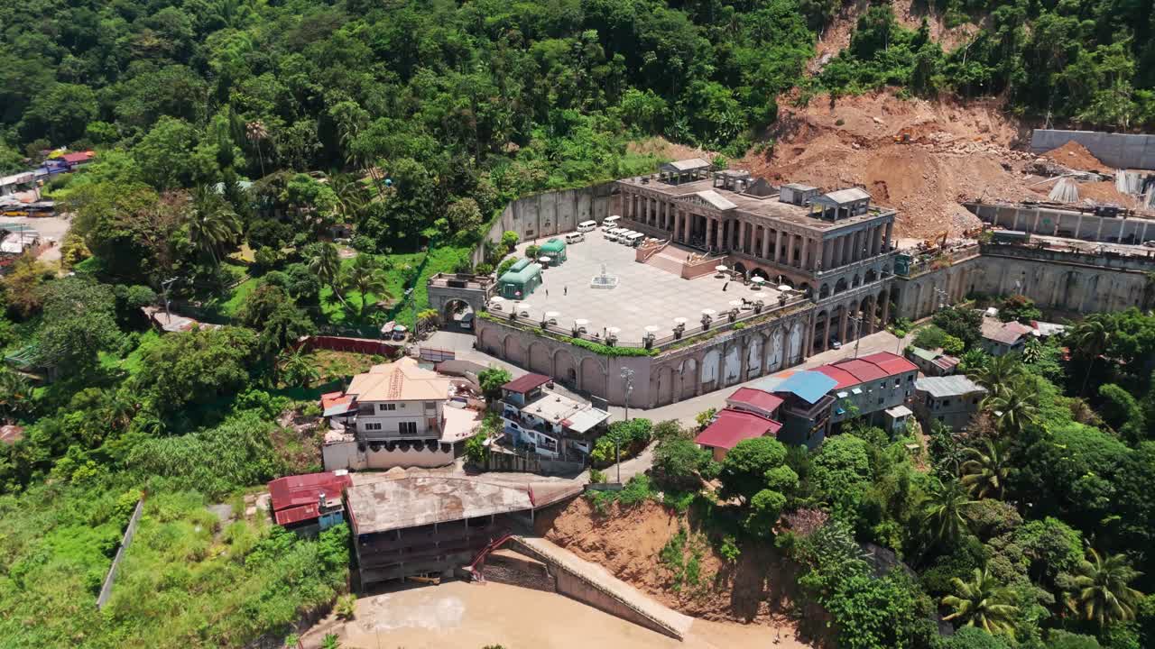 4K aerial drone footage of a grand architectural landmark nestled in lush tropical forest near Cebu, Philippines. Ideal for travel, tourism, architecture, heritage, and real estate marketing content