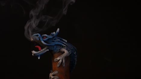 Chinese-long-dragon-statue-exhaling-smoke-while-rotating-in-a-studio