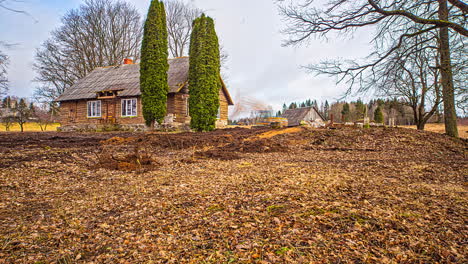 bulldozer tractor preparing the ground in front of farm property