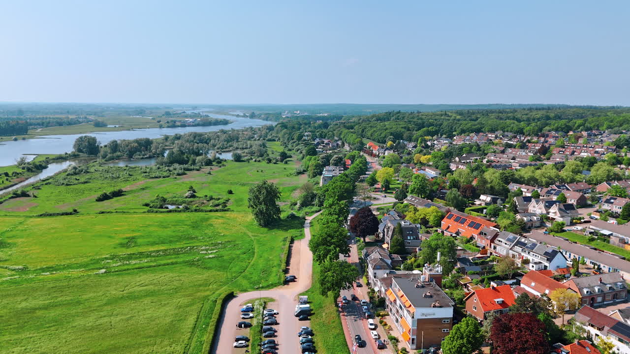 Beautiful picturesque city with low-rise architecture on the green waterfront of the river. Panorama of Rhenen, Province Utrecht, the Netherlands.